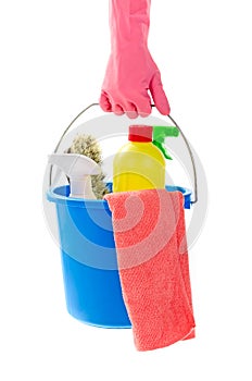 Hand holding bucket of cleaning materials