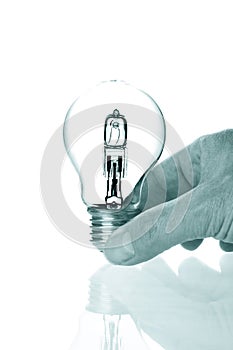 Hand holding bulb lamp