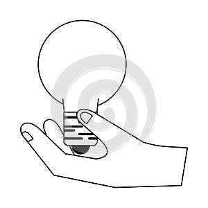 Hand holding bulb light symbol isolated in black and white