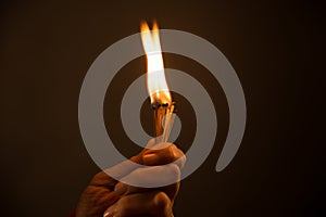 Hand holding Burning Matches. studio shot,close up,