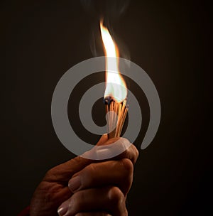 Hand holding Burning Matches. studio shot,close up,