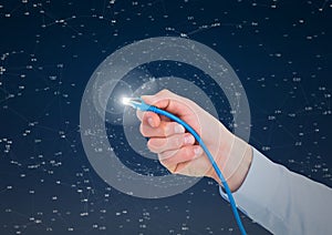 Hand holding a cable with light flare