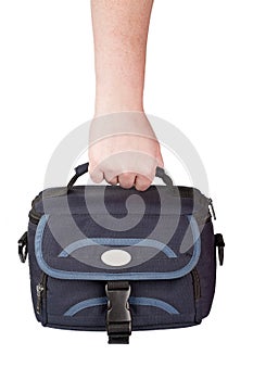 Hand holding camera bag