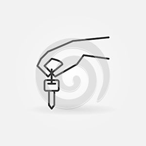 Hand holding car key icon
