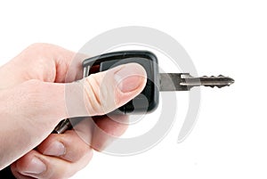 Hand holding car keys isolated