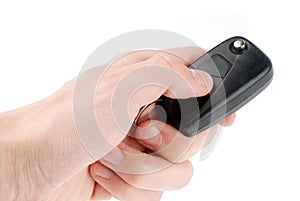 Hand holding car keys isolated