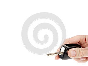 Hand holding car keys isolated
