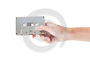Hand holding cassette tape isolated