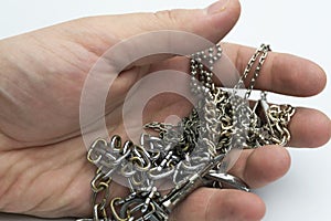 Hand holding a chain.