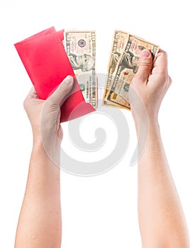 Hand holding chinese red envelope with money isolated over white background