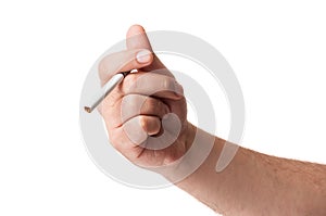 A hand holding a cigarette isolated on white background