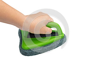 Hand holding and cleaning with brush scrubber isolated white background