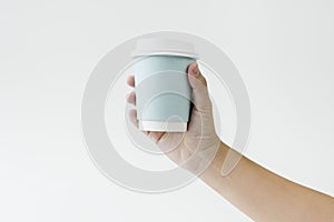 Hand holding coffee cup mockup blank isolated background