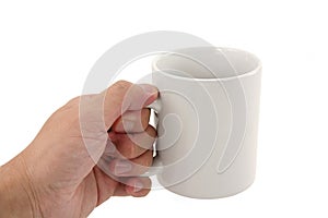 Hand holding coffee mug photo