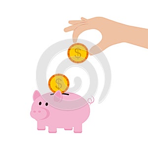 Hand holding coin to insert to pink piggy bank isolated on background.