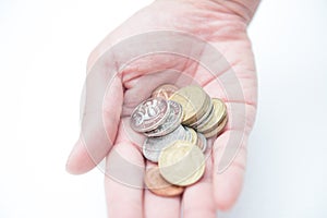 Hand holding coins