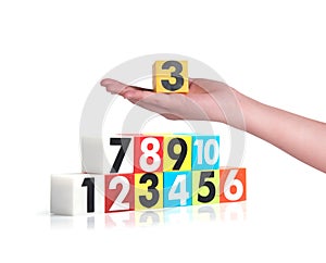 Hand holding colorful plastic numbers on white background ,No1