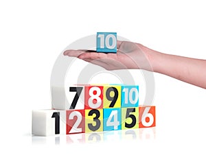 Hand holding colorful plastic numbers on white background ,No10