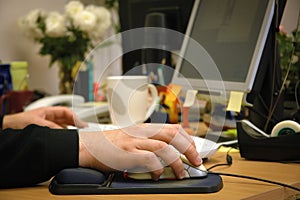 Hand holding computer mouse