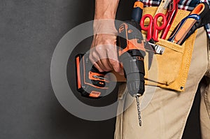 Hand holding construction tools