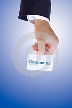 Hand holding contact us card