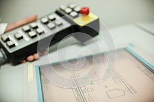 Hand holding the control panel