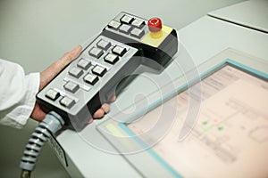 Hand holding the control panel