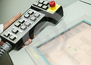 Hand holding the control panel