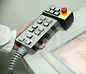 Hand holding the control panel