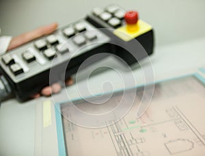 Hand holding the control panel