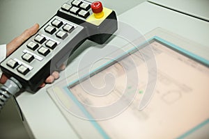 Hand holding the control panel