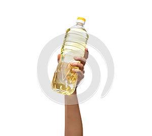 hand holding cooking oil in plastic bottle