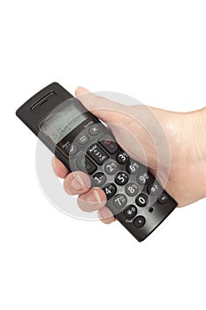 A hand holding a cordless telephone