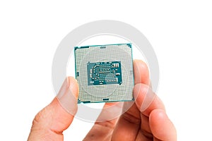 A hand holding cpu processor