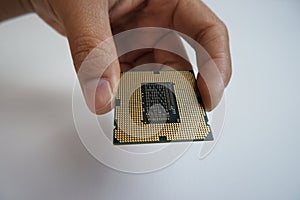 Hand holding CPU processor