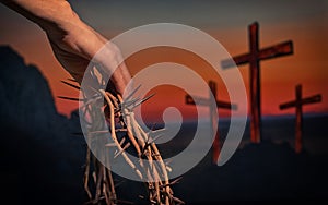 Hand holding crown of thorns andThree Crosses On Calvary Hill