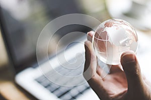 Hand holding crystal world. business symbol