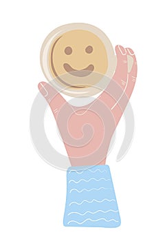 Hand holding cup of coffee with smiling face inside