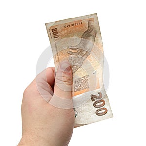 Hand holding Czech bank note