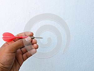 Hand holding dart