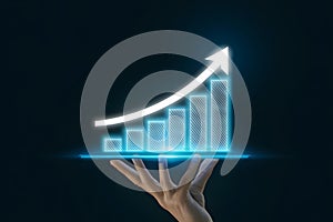 Hand holding digital bar graph, blue arrow pointing up, symbolizing growth, on dark background