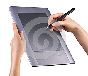 Hand holding digital graphic pen and drawing graphic tablet isolated on white