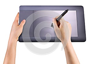 Hand holding digital graphic pen and drawing graphic tablet isolated on white