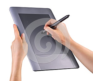 Hand holding digital graphic pen and drawing graphic tablet isolated on white