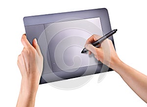 Hand holding digital graphic pen and drawing graphic tablet isolated on white