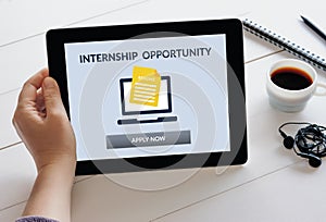 Hand holding tablet with internship concept on screen