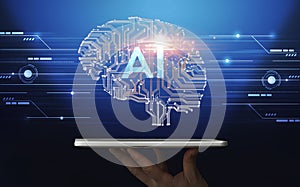 Hand holding digital tablet with human brain proection