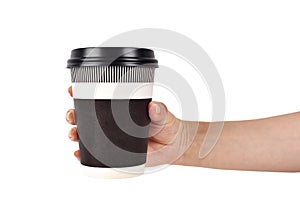 Hand holding disposable coffee cup