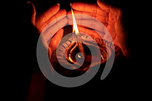Hand Holding Diwali Diya