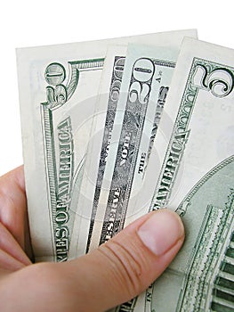 Hand holding dollar bills